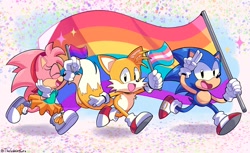 Size: 2048x1253 | Tagged: safe, artist:thegaminggoru, amy rose, miles "tails" prower, sonic the hedgehog, fox, hedgehog, 2023, abstract background, bisexual pride, classic amy, classic sonic, classic style, classic tails, confetti, eyes closed, female, flag, holding something, looking at viewer, male, pride, pride flag, signature, smile, star (symbol), trans pride, trio, walking