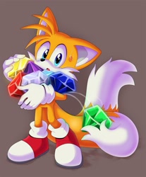 Size: 1695x2048 | Tagged: safe, artist:montyth, miles "tails" prower, fox, 2023, :o, brown background, chaos emerald, holding something, male, mouth open, simple background, solo, standing, surprised, sweatdrop, tail hold