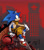 Size: 2048x2327 | Tagged: safe, artist:sonic-heart-of-mobius, egg pawn, sonic the hedgehog, hedgehog, abstract background, au:heart of mobius, bandage, bandana, frown, looking offscreen, male, pants, robot, robotnik's logo, sitting, solo, top surgery scars, trans male, transgender