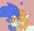 Size: 665x600 | Tagged: safe, artist:cuppylocker, miles "tails" prower, sonic the hedgehog, 2024, blushing, cute, duo, eyes closed, flat colors, gay, heart, holding hands, lidded eyes, looking at them, pink background, shipping, simple background, smile, sonic x tails, standing, wagging tail