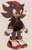 Size: 1110x1754 | Tagged: safe, artist:boogercats, shadow the hedgehog, hedgehog, 2025, beige background, clothes, cute, fingerless gloves, frown, fully clothed, heart, looking offscreen, male, shadow's logo, shadowbetes, shorts, simple background, solo, standing, sweatdrop, sweater