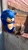 Size: 1153x2048 | Tagged: safe, artist:nathanzicaofici, sonic the hedgehog, hedgehog, 2025, 3d, brick wall, looking at viewer, male, movie style, outdoors, sitting, smile, solo, wall