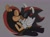 Size: 2048x1510 | Tagged: safe, artist:imlostandgay, mighty the armadillo, shadow the hedgehog, armadillo, hedgehog, 2026, blushing, duo, eyes closed, fur markings, gay, grey background, holding hands, kiss, kneeling, mightadow, shipping, simple background