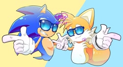 Size: 2048x1117 | Tagged: safe, artist:elly, miles "tails" prower, sonic the hedgehog, 2022, clenched teeth, duo, looking at viewer, pointing, signature, simplistic background, smile, sunglasses
