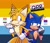 Size: 1880x1609 | Tagged: safe, artist:jeffydust, miles "tails" prower, sonic the hedgehog, 2026, aged up, aro ace pride, aromantic, asexual, bisexual, bisexual pride, duo, ear flop, gay, headcanon, lidded eyes, linking arms, looking at viewer, male, nonbinary, nonbinary pride, nonbinary tails, older, one fang, pansexual, pansexual pride, pride, pride flag, pride flag background, pride month, queerplatonic, queerplatonic pride, shipping, sonic x tails, standing, text, trans boy sonic, trans male, transgender, wink
