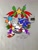 Size: 1536x2048 | Tagged: safe, artist:superguy551, sonic the hedgehog, 2021, character name, grey background, looking at viewer, simple background, sitting, smile, solo, star (symbol), wreath